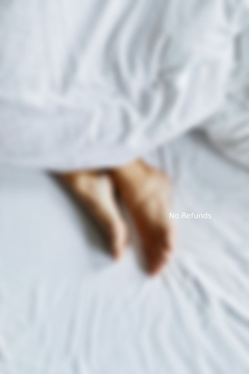 Relaxed toes on bed